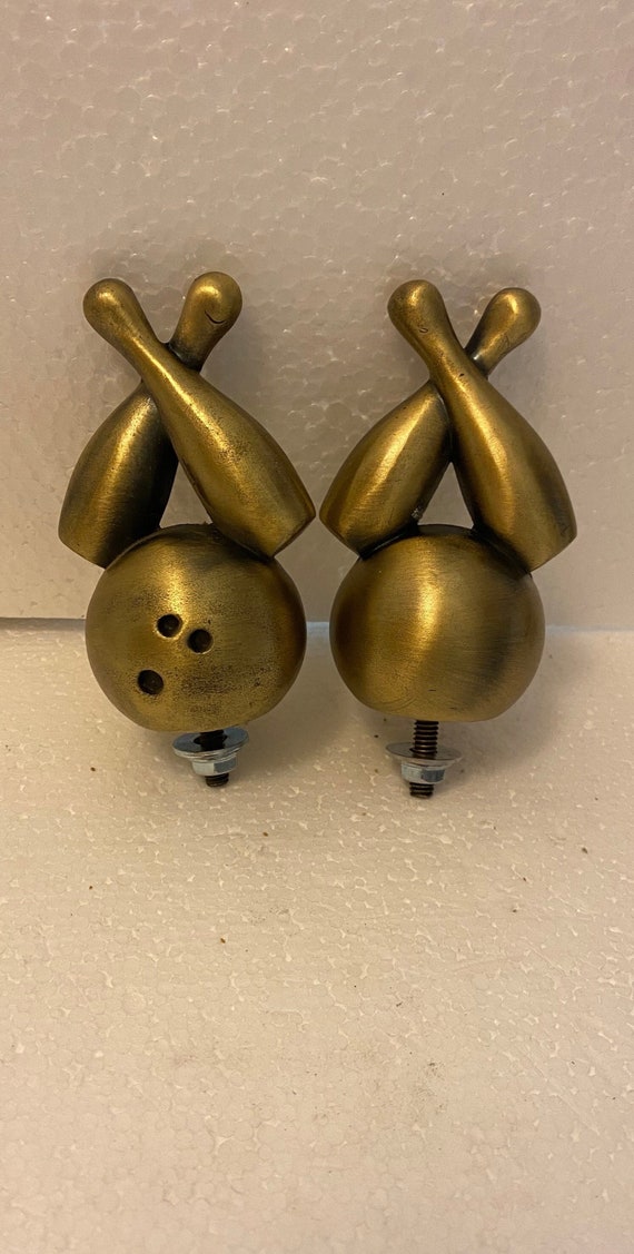 A Vintage Bowling Ball and Pins 4" tall re-issue auto car hood ornament mascot in several finishes  Made in the USA.