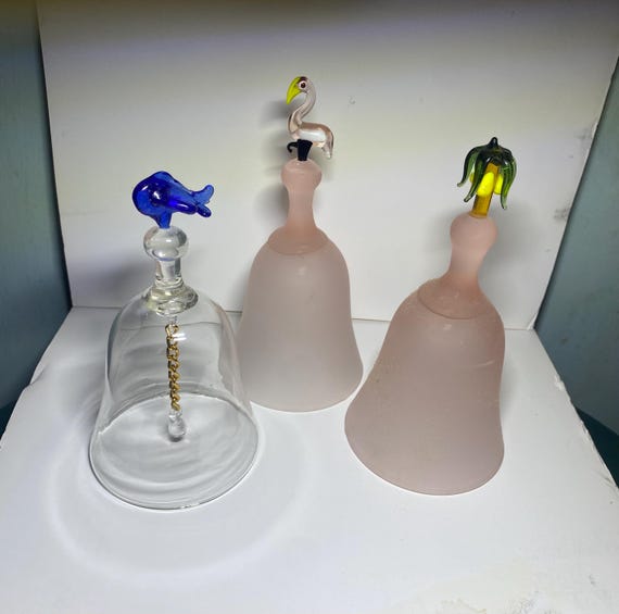 Several Funky Vintage Lead Crystal Glass 6" tall Dinner Bells Flamingoes, Palm Trees and an Airplane.