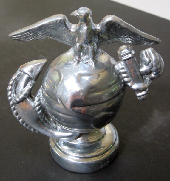 A USMC Marine Corps Insignia paperweight in Highly Polished Aluminum Made in the USA