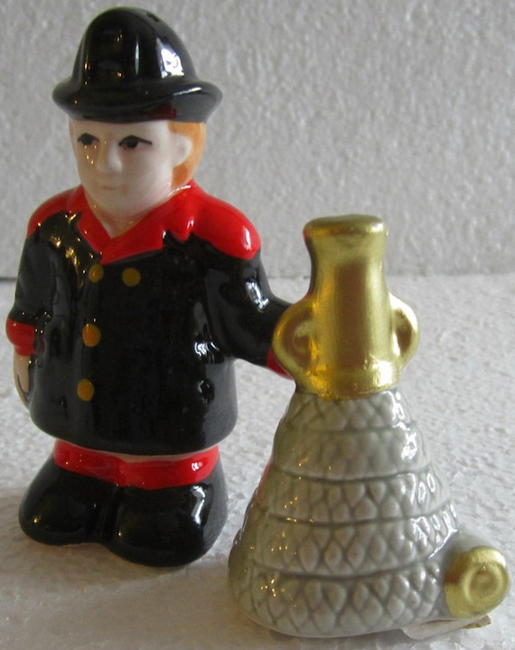 A Fireman and Fire Hose Salt and Pepper Collectables #456