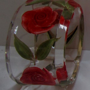 A Very Large Vintage Reversed Carved Oval Lucite Bracelet with Red Roses and Green Leaves.