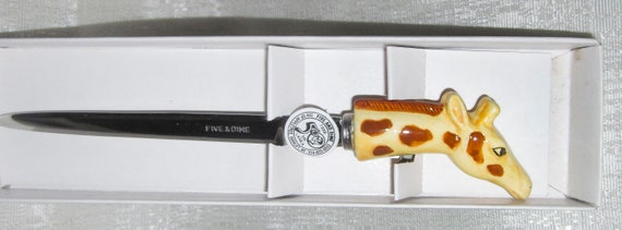 A Vintage Giraffe Letter Opener ceramic and stainless steel 1980's 7" tall Style 52