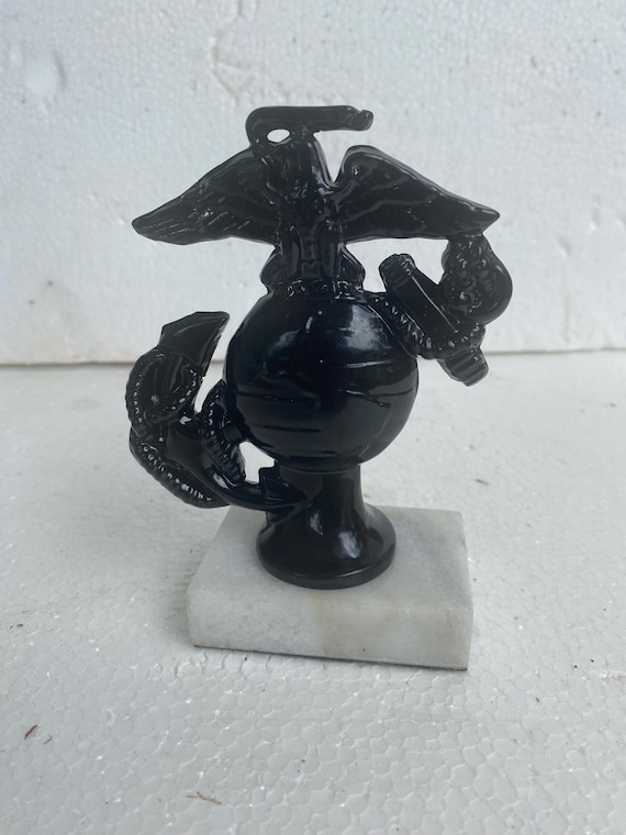 A USMC Marine Corps Paperweight or Trophy of a thin Insignia as a very unusual piece, as below, in gloss Black and made of metal  USA