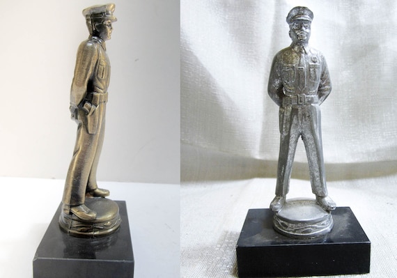 The 1940s to 50's Metal  Policeman who is 6.5" Tall and a detailed figurine or trophy Metal Made in the USA