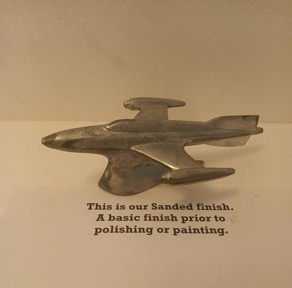 50's Old's Rocket auto car motorcycle hood ornament mascot in sanded aluminum 6-1/2" long USA