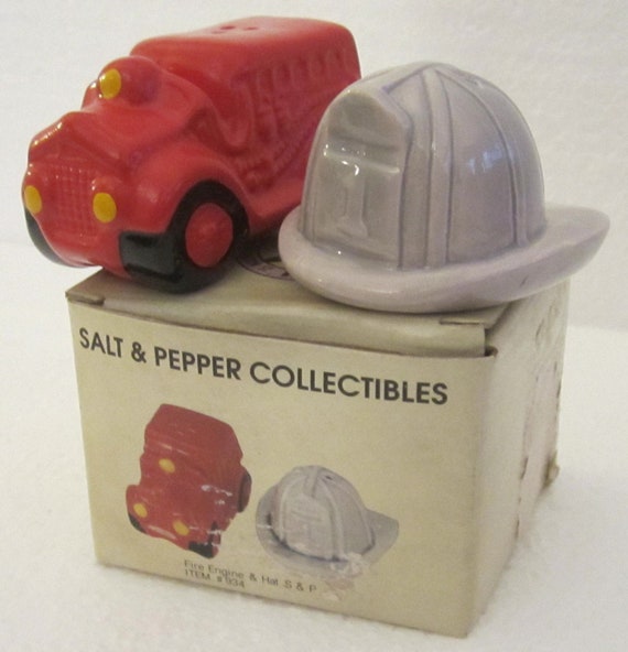 A Vintage Ceramic Fireman Truck and Fire Helmet salt and pepper shakers 3" Tall, a pair Style #934