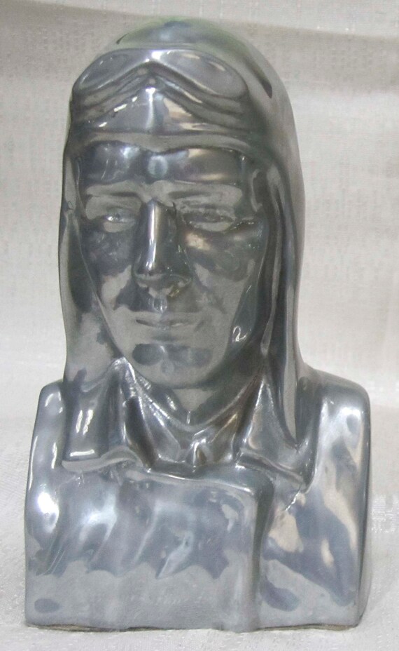 A Vintage Charles Lindbergh aviator bust NX-211 Art Deco bookend in several finishes, metal, sold each, single, made in the USA