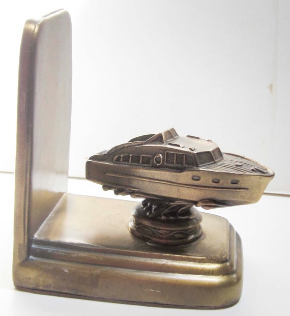 1950's Cabin Cruiser bookend or doorstop in satin brass finish, single USA