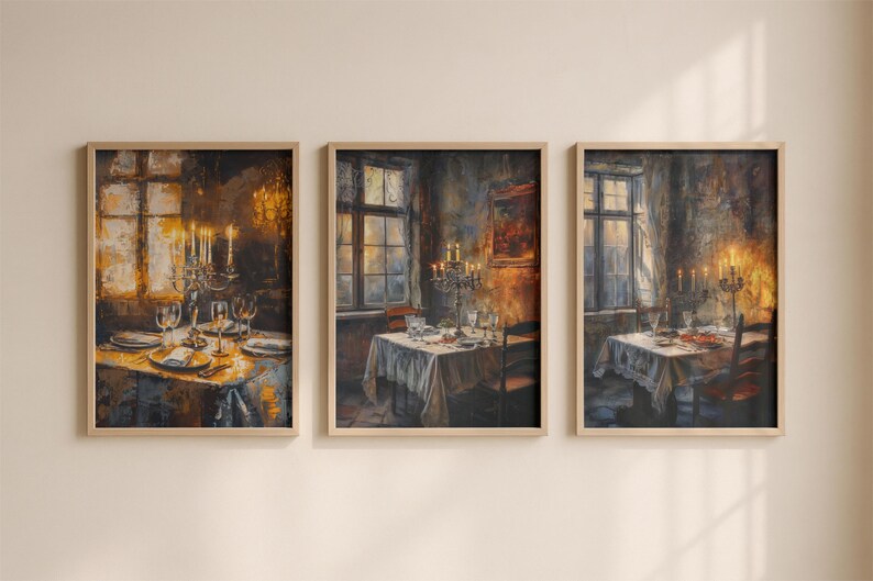 May include: A set of three vertical wall art prints in light wood frames, each depicting an oil painting of a dining room scene with a table set for a meal, a candelabra with lit candles, and a window with warm golden light filtering through.