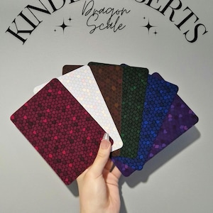 May include: A selection of Kindle inserts in a range of colours, each featuring a dragon scale design. The inserts are matte cardstock and sold individually. Text at the top reads "Kindle Inserts Dragon Scale".