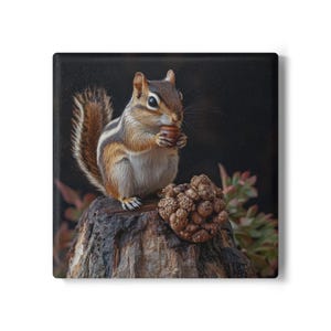 May include: A square print featuring a chipmunk holding a nut, perched on a weathered tree stump. The chipmunk has brown and white stripes, with a fluffy tail. A textured, brown object and green foliage are also visible.