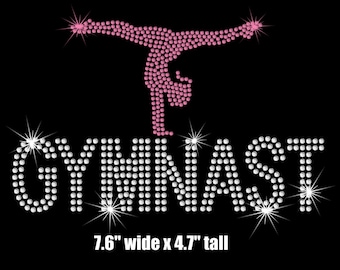 May include: Rhinestone design of a gymnast in a pink silhouette with the word "GYMNAST" in white rhinestones. The design measures 7.6 inches wide by 4.7 inches tall.