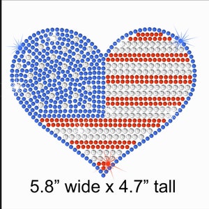 May include: A red, white, and blue American flag heart design made of rhinestones. The heart is 5.8 inches wide and 4.7 inches tall.