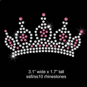 May include: A rhinestone crown design with clear and pink rhinestones. The crown is 3.1 inches wide and 1.7 inches tall. The rhinestones are size 6 and size 10.