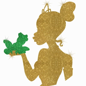 May include: A gold glitter silhouette of a princess with a crown, holding a green glitter frog in her hand.