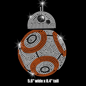 May include: A rhinestone-covered design of a popular droid character from the Star Wars franchise. The design is 5.6 inches wide and 8.4 inches tall.