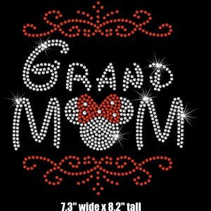 May include: Rhinestone iron-on design featuring the words "Grand Mom" with a red bow and Mickey Mouse ears. The design is 7.3 inches wide and 8.2 inches tall.