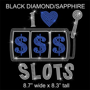 May include: Black background with a rhinestone design that says "I ♥ Slots". The design includes a heart, a slot machine with dollar signs, and a lever. The text "BLACK DIAMOND/SAPPHIRE" is at the top. The design is 8.7" wide x 8.3" tall.