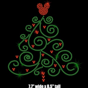 May include: A green and red rhinestone Christmas tree design with Mickey Mouse heads. The tree is 7.7 inches wide and 8.5 inches tall.