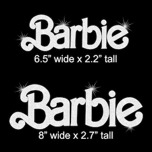 May include: Two white glittery Barbie logos on a black background. The top logo measures 6.5 inches wide by 2.2 inches tall. The bottom logo measures 8 inches wide by 2.7 inches tall. Both logos feature a stylized script font with starburst accents.