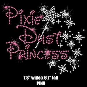 May include: Pink rhinestone iron-on design featuring the words "Disney Princess" with a wand and stars. The design measures 7.8 inches wide by 6.7 inches tall.