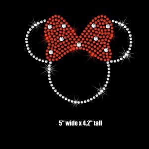 May include: A rhinestone design of a mouse head with a red bow. The design is 5 inches wide and 4.2 inches tall.