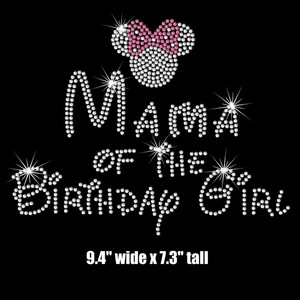 May include: Rhinestone iron-on design featuring a pink and white Minnie Mouse head with the text "Mama of the Birthday Girl" in white rhinestones. The design measures 9.4 inches wide by 7.3 inches tall.