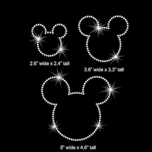 May include: Three different sizes of rhinestone Mickey Mouse head designs. The smallest is 2.6 inches wide by 2.4 inches tall. The middle size is 3.6 inches wide by 3.3 inches tall. The largest is 5 inches wide by 4.6 inches tall.