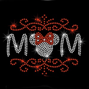 May include: A black t-shirt with a rhinestone design that says "Sweetie Mom" with a red and white rhinestone Mickey Mouse head in the middle.