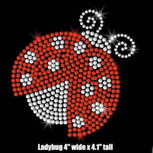 May include: Red and white rhinestone ladybug design, 4 inches wide by 4.1 inches tall.