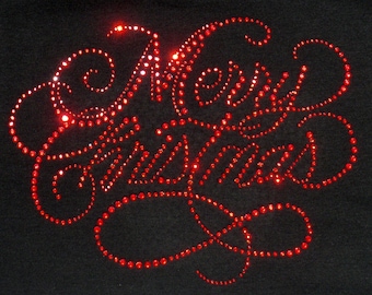 May include: A black fabric surface featuring the text Merry Christmas written in a cursive script. The lettering is formed by numerous small, reflective red rhinestones that catch the light, creating a bright and sparkling visual effect.