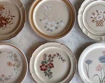 Vintage 70/80's mismatched cottage stoneware dinner plates. Sold individually.