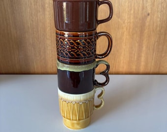 Vintage 1970's stackable mismatched stoneware mugs made in Japan. Sold separately.