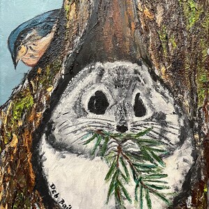 May include: A painting of a grey and white squirrel with large eyes, holding a green branch in its mouth. The squirrel is nestled in a tree trunk, with a blue bird perched on a branch above it. The painting is signed "Deb Bailey" in the bottom left corner.