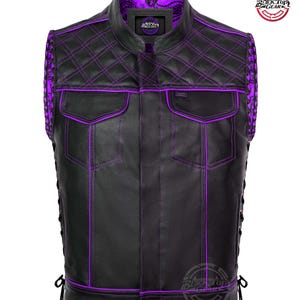 May include: Black leather vest with purple stitching and accents. Features a quilted pattern on the shoulders and collar, two front pockets, and side lacing. The vest has a mandarin collar and a purple paisley lining.