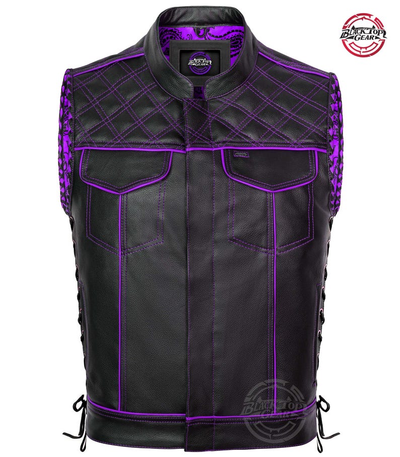 May include: Black leather vest with purple stitching and accents. Features a quilted pattern on the shoulders and collar, two front pockets, and side lacing. The vest has a mandarin collar and a purple paisley lining.