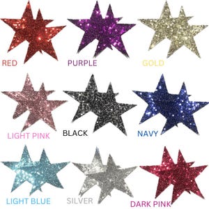 May include: Assortment of 10 double-layered star shaped sequins in various colours: red, purple, gold, light pink, black, navy, light blue, silver, and dark pink.