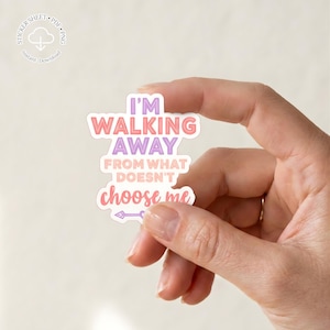 May include: A die-cut sticker with the text "I'M WALKING AWAY from what DOESN'T choose me" in pink, purple, and white. The sticker is held in a hand, and the design includes an arrow. The sticker is a digital download.