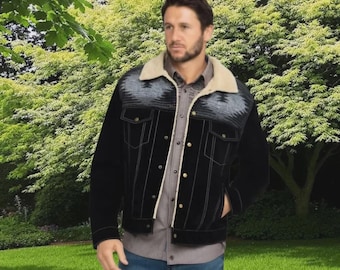 May include: Black denim jacket with a cream-colored sherpa collar and lining. The jacket features a gray and black patterned yoke and cream-colored stitching. It has button closures and two chest pockets.