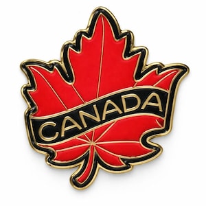 May include: A metal pin shaped like a maple leaf with a vibrant red enamel finish and gold-coloured metal outlines. A black banner crosses the centre of the leaf with the word CANADA embossed in gold capital letters, framed by a thin black border.