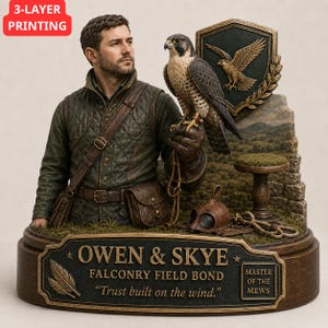 May include: A detailed resin sculpture featuring a man in a quilted vest with a falcon perched on his gloved hand. The base includes a plaque reading OWEN & SKYE FALCONRY FIELD BOND Trust built on the wind. MASTER OF THE MEWS, a shield, and a stool.