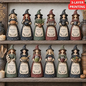 May include: Twelve decorative witch figurines arranged on two shelves. Each figure wears a pointed hat and a dress featuring a unique label, such as Bread Witch, Soup Witch, Herb Witch, Spice Witch, Tea Witch, Coffee Witch, Garlic Witch, Pasta Witch, Ferment Witch, Dessert Witch, Preserve Witch, and Pantry Witch, along with small accessories.
