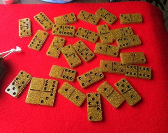 Domino tile games peices.  Gold glitter tiles. Paw prints, and hearts adorn these wonderful tile pieces.  Enjoy this game while camping.