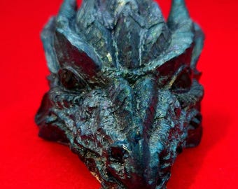 Spectacular fantasy dragon piece that keeps watch over you. Metallic coloring.