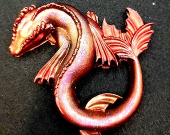 Spectacular fantasy dragon piece that keeps watch over you. Metallic shimmering coloring.