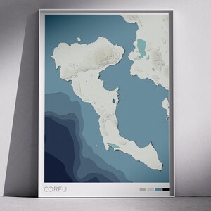 May include: A framed map print of Corfu island, Greece. The artwork features a layered topographic design in shades of blue and white, with the word "CORFU" at the bottom. The print is displayed in a white frame.