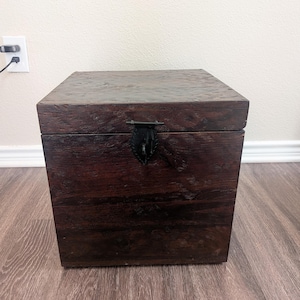 May include: A set of three ceramic mugs with a speckled, matte finish. The mugs are in shades of cream, light gray, and dark gray. Each mug has a simple, minimalist design and a rounded handle.