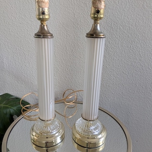 May include: A set of three ceramic mugs with a speckled, matte finish. The mugs are in shades of cream, light gray, and dark gray. Each mug has a simple, minimalist design, perfect for coffee or tea.