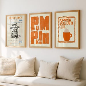 May include: Three framed art prints with a fall theme. The prints feature the words "Pumpkin Spice Latte Club", "Pumpkin", and a guest check that says "One Pumpkin Spice Latte Please". The prints are in wooden frames.