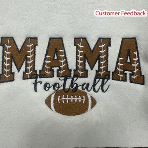 May include: Brown embroidered sweatshirt with the text "MAMA Football" and a brown football graphic.